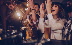 Friends Cheering in Pub